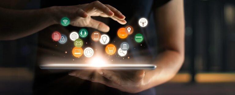 Hands over a tablet with glowing marketing and communication icons