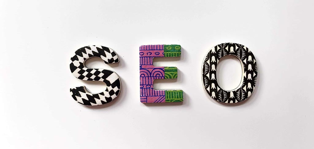 Colourful patterned letters spelling SEO