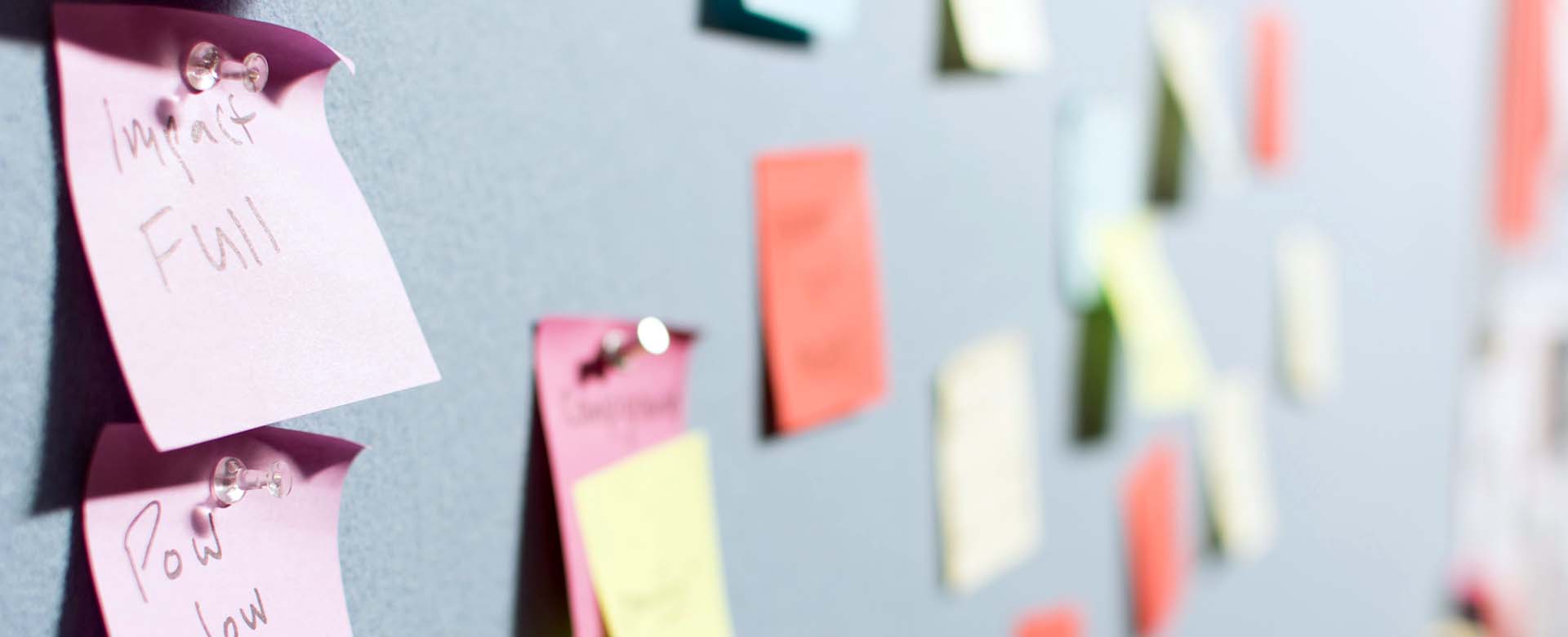 Sticky notes with keyword ideas pinned to a wall