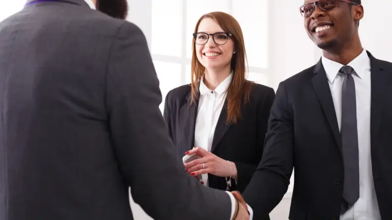Business people shaking hands after choosing an agency