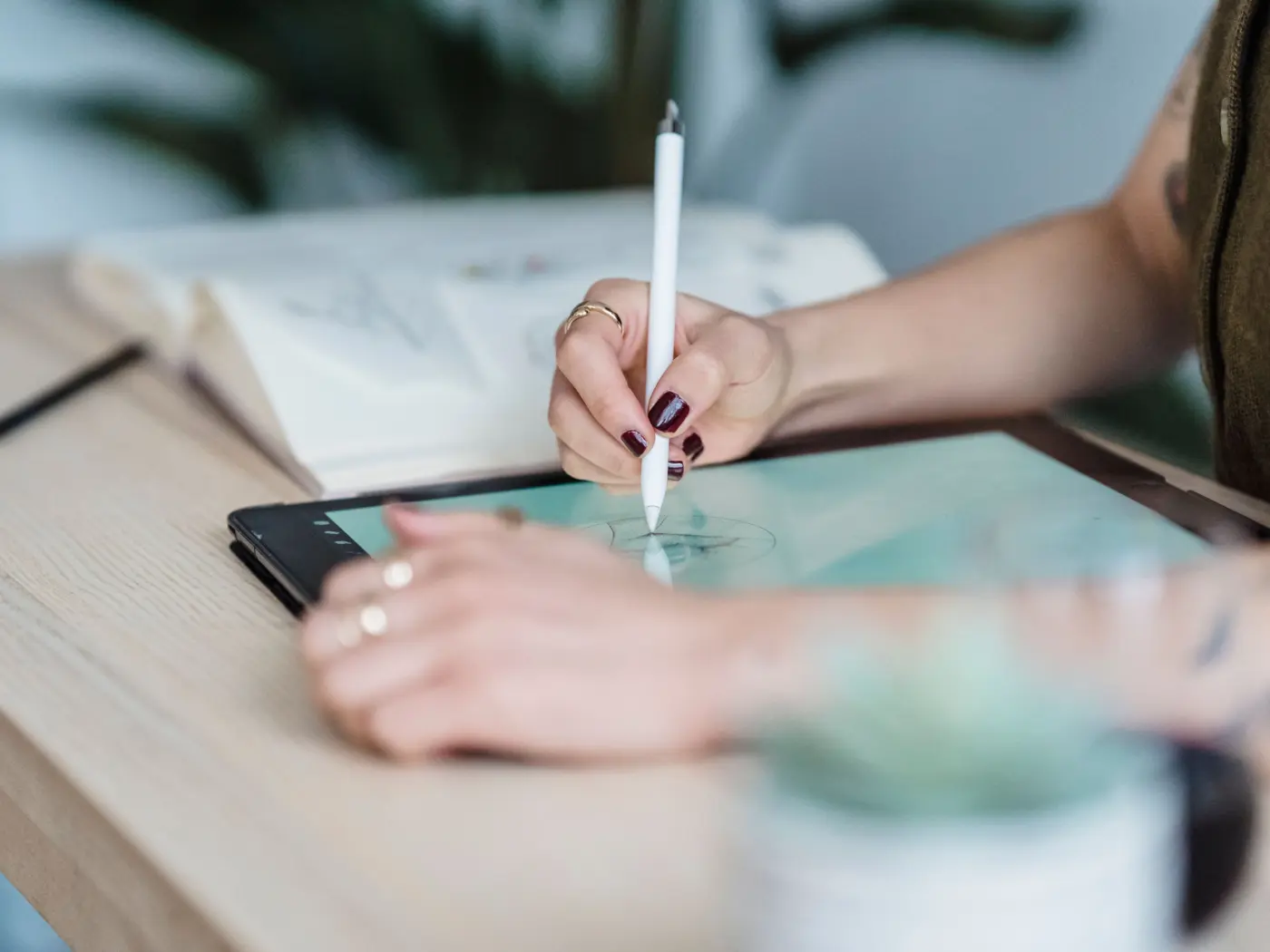 Designer drawing on a graphics tablet with a stylus