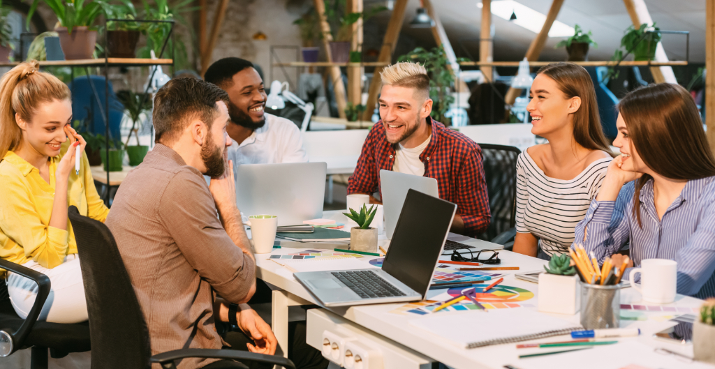 Creative start-up team discussing ideas in modern office