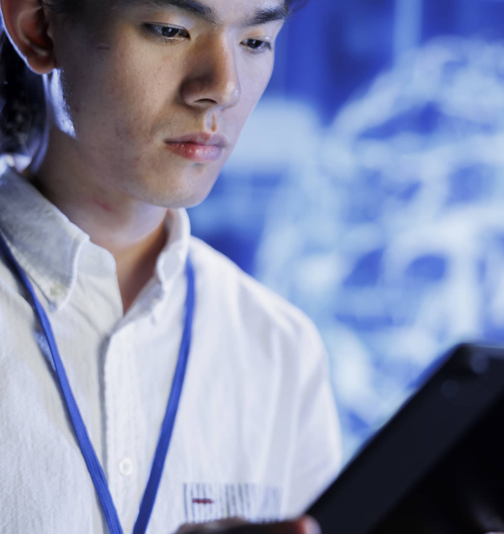 Young professional reviewing data on a tablet in a modern office